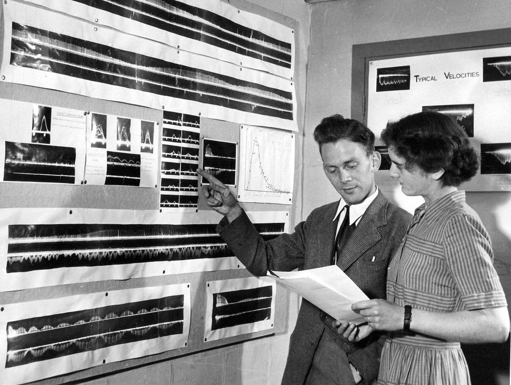 A black-and-white image from 1951 showing Mary Almond and – possibly – J.S. Greenhow inside the historic Radiant Hut, studying film graphs of radar echoes from meteors. 