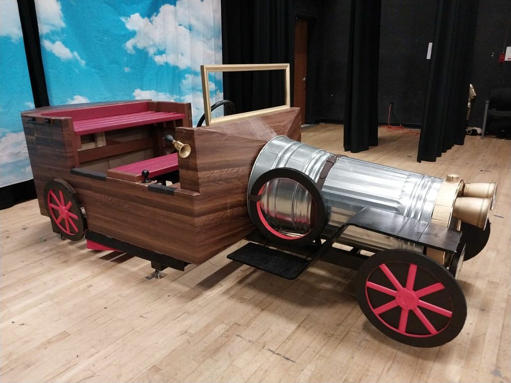 This was made by scratch for a production of Chitty Chitty Bang Bang. Does not drive but sturdy enough to seat up to 6 people. Wheels fold up and wings pop out using puppetry from the front seat. The headlights turn on via remote control. It was a blast to put together!
