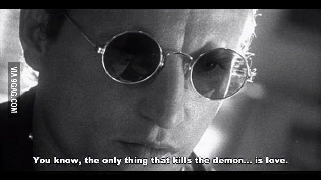 Closeup of Woody Harrelson as Mickey in the film Natural Born Killers saying, "You know, the only thing that kills the demon... is love." 