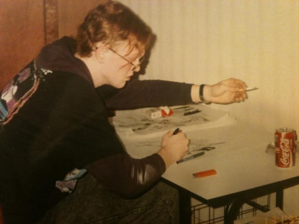 1994: sitting at my first drafting table sipping on Coca-Cola, puffing a Marlboro red, and drawing comic book pages.