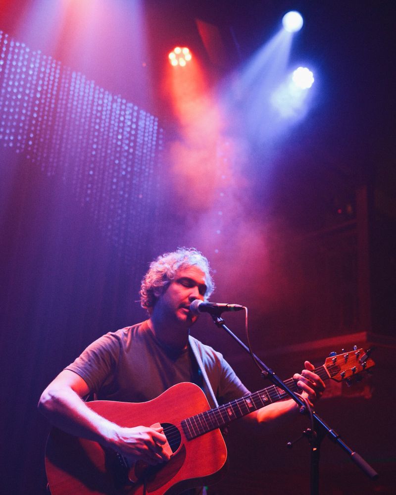 Mike Polizze, a guitarist, playing on stage