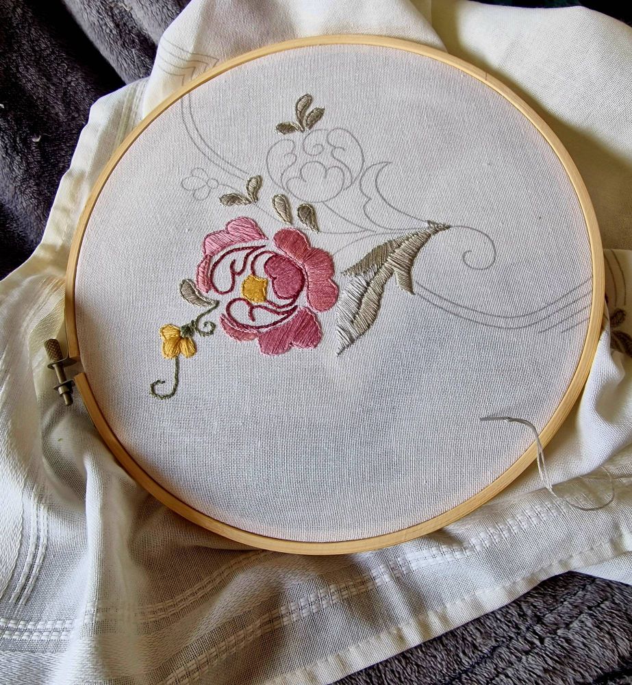 Stamped satin stich peony in shades of pink and tiny gold buttercups accented with silvery grey and sage green foliage. 