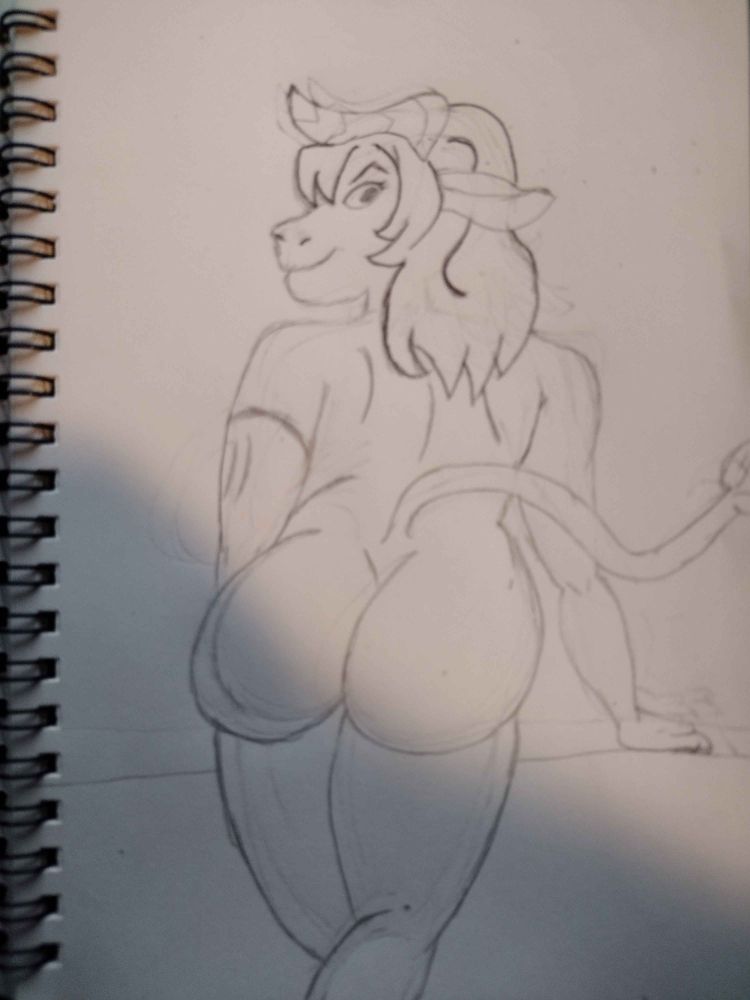 Nude bovine lady looking back over her shoulder. 