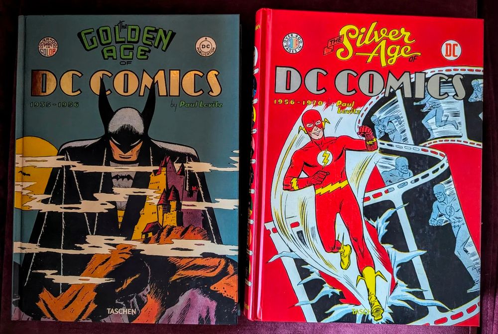 Copies of The Golden Age of DC Comics and the Silver Age of DC Comics published by Taschen.