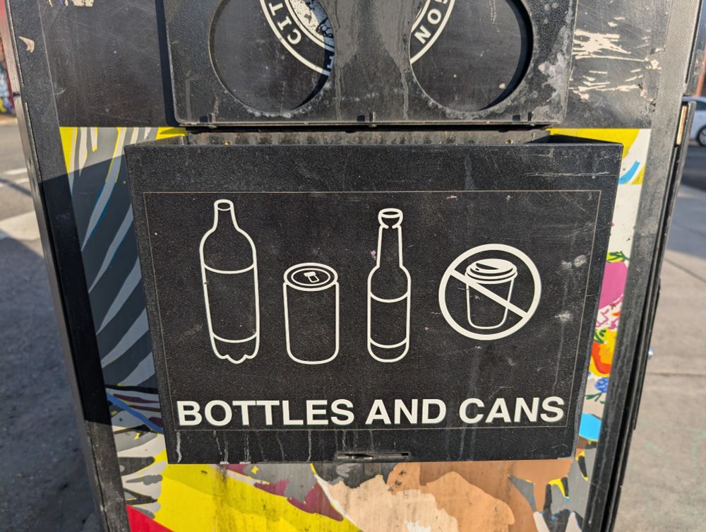 A sign that says BOTTLES AND CANS 