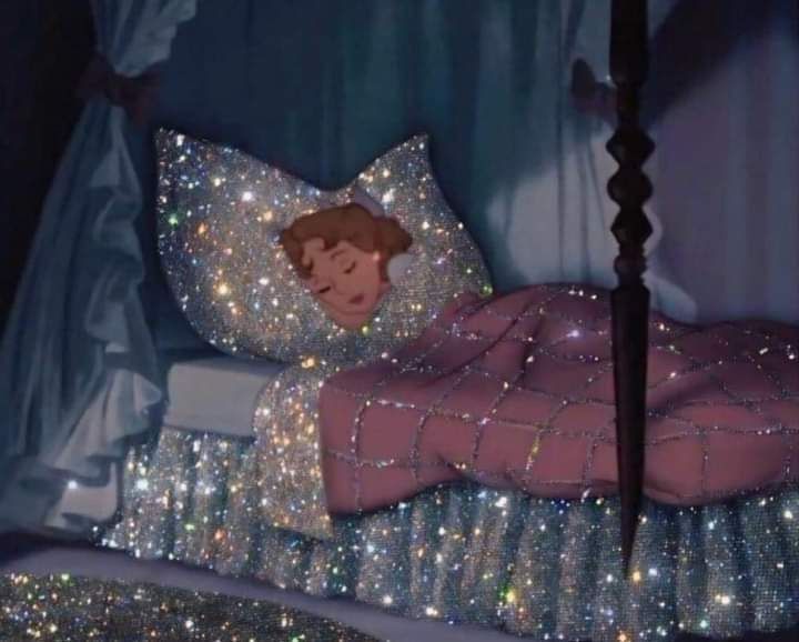 A photo of Wendy from Peter Pan in bed but the bed is glittery 