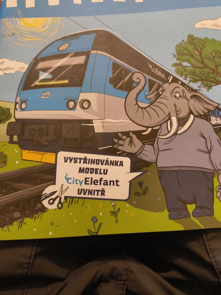 Cartoon picture of a City Elefant train with a cartoon elephant saying words in Slovak 