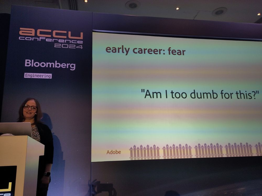 Laura in front of her slide with the quote "Am I too dump for this?"