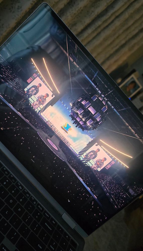 a photo of a laptop screen playing the livestream of Love Out Loud 2025 Fanfest