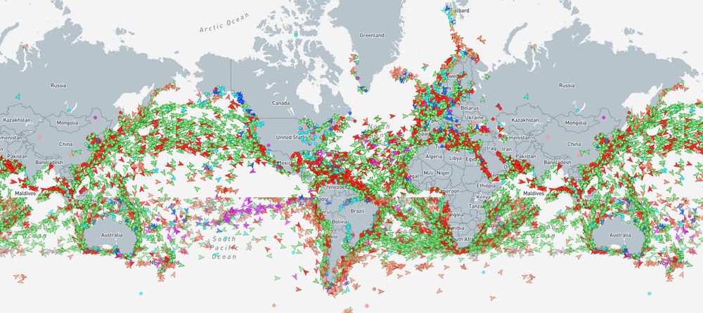 A screenshot from Marine traffic.com.  A map of the world, with thousands of colored dots.  Each dot representing a ship.