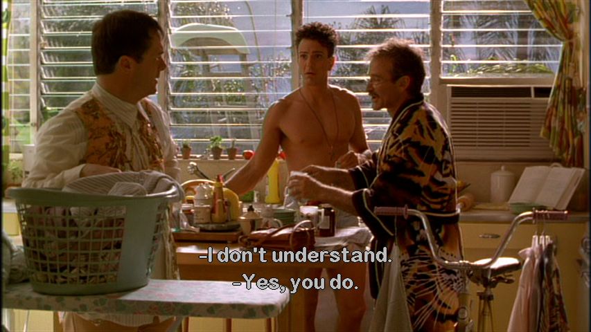 A screen capture of The Birdcage, with Robin Williams in a robe, Nathan Lane on the left side of the screen, and Hank Azaria's chest.