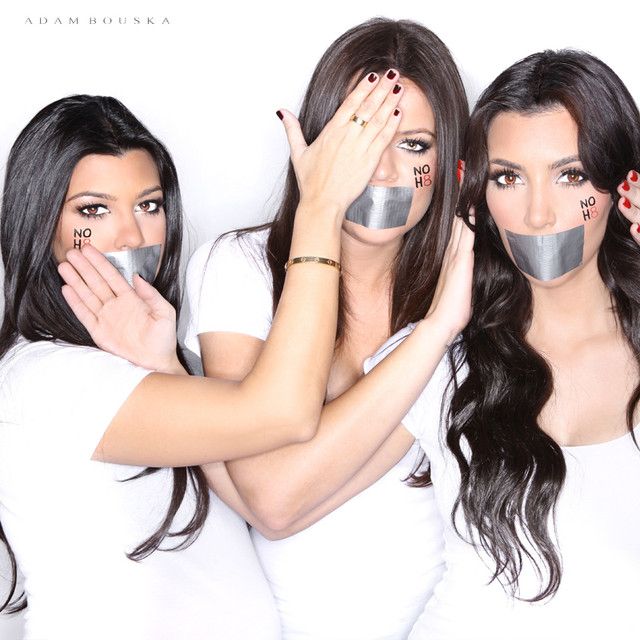 three kardasian siblings with tape on their mouths and NOH8 painted on their cheeks