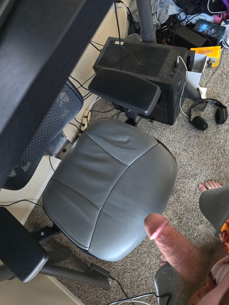 I'm at my standing desk with my dick out. There is a chair under the desk. 