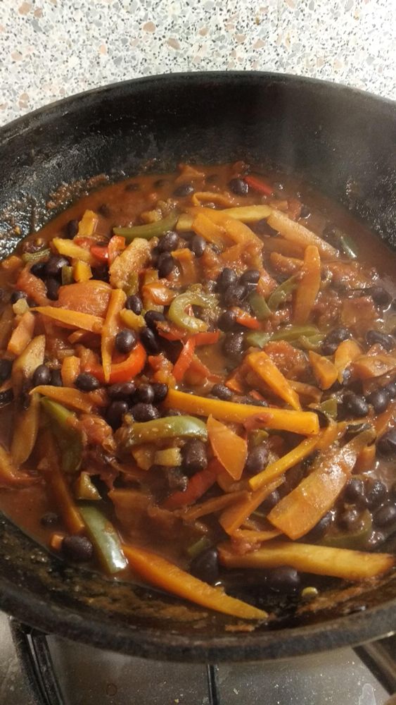 Mixed vegetable chilli showing carrots, red and green peppers and black beans. There's parsnip in there too, but it's hard to make it out amongst everything else!