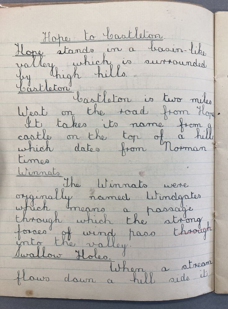 Very neatly written text in a school copybook, with title 'Hope to Castleton'. The first sentence reads: "Hope stands in a basin-like valley which is surrounded by high hills."