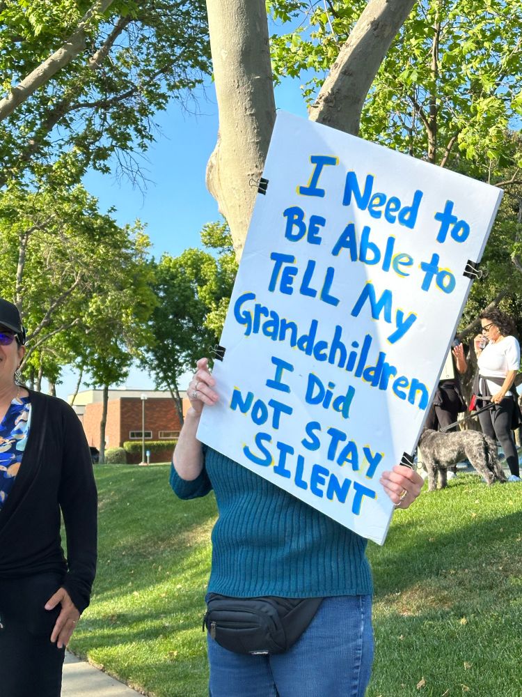 Sign which reads “I need to be able to tell
my grandchildren I did not stay silent”