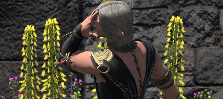Urianger with his left hand over his face, doing a dramatic pose.