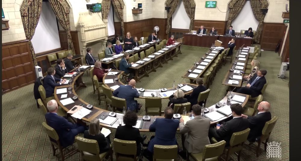 MPs sitting in Westminster hall while Jo Platt stands to speak