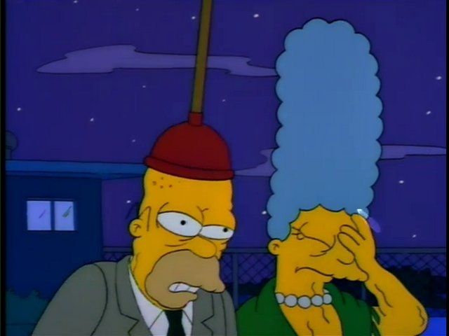 An old Homer Simpson with a plunger on his head
