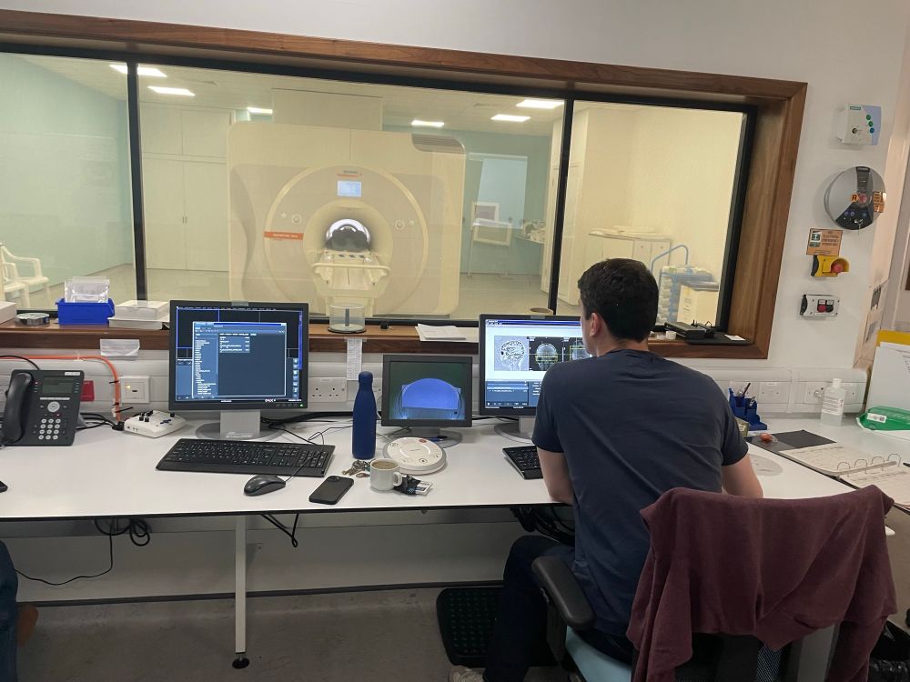 Control room of the Glasgow 7T MRI scanner, with high resolution anatomical image on screen.