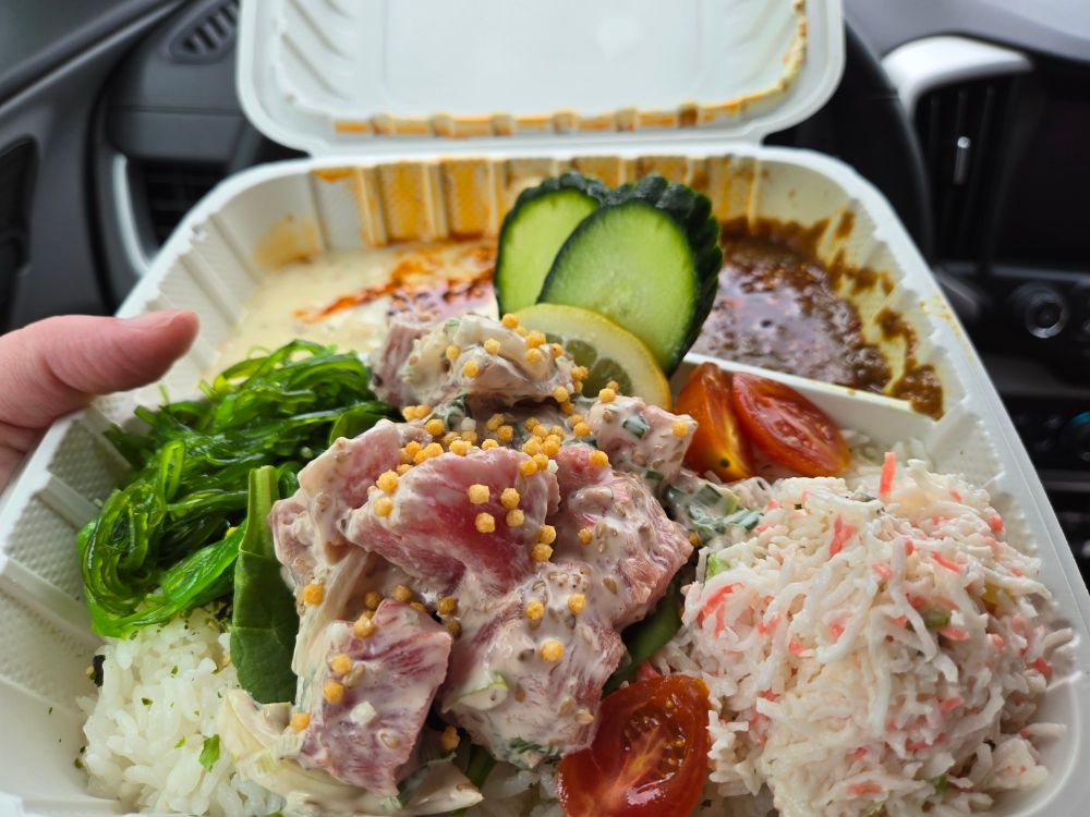 Chowder,  curry, and a pile of tuna poke over a bed of rice. 