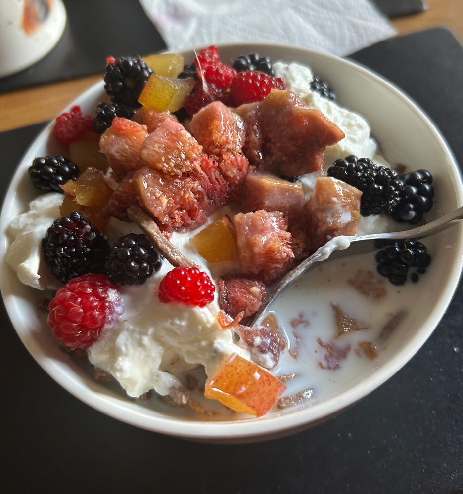 Breakfast plate topped with Figs, Mulberries, Raspberries,Plums, Blackberries, and Japanese Wineberries.