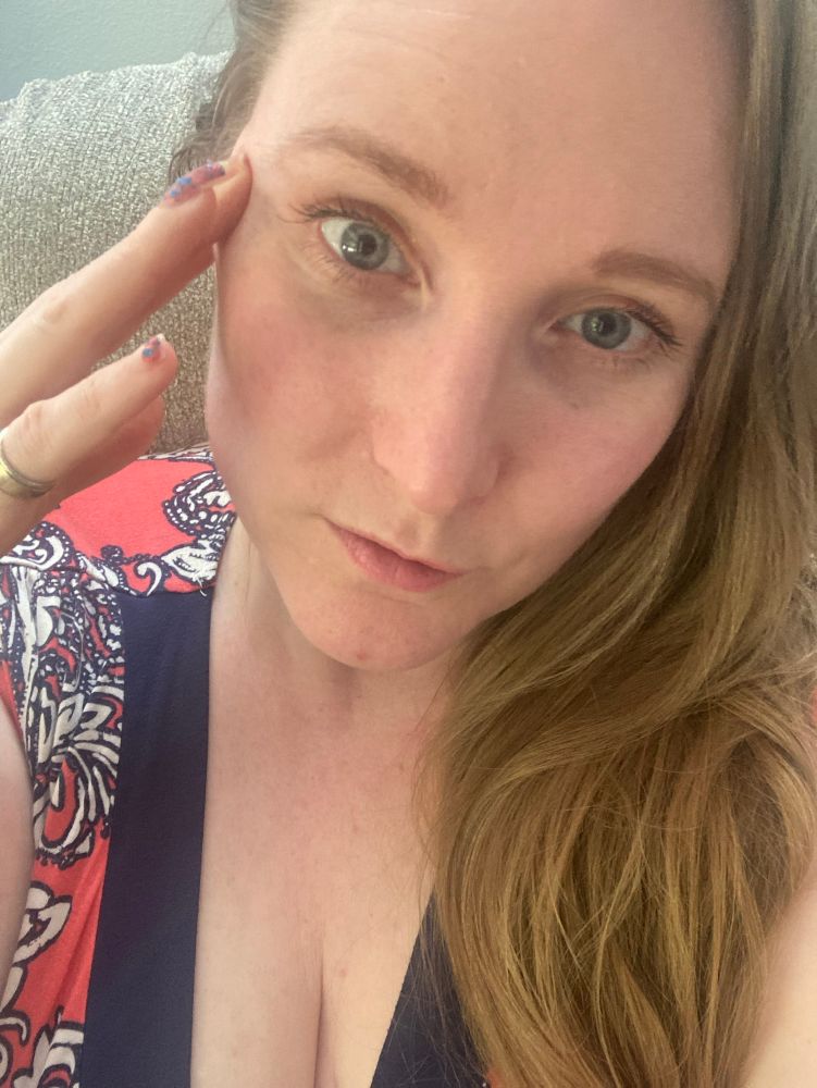 A blonde woman with blue eyes, pressing her fingers to her temple as she reads the minds of the most degenerate people in the universe. 