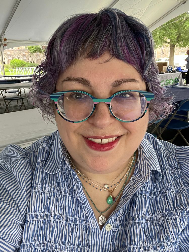 Selfie, my hair is in a ponytail but all the short shaggy layers are just hanging out 