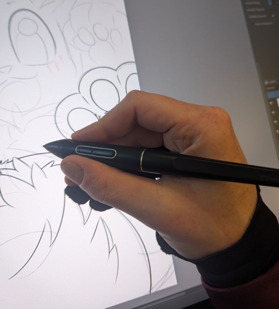 A hand holding a pen, showing off a grip pose 