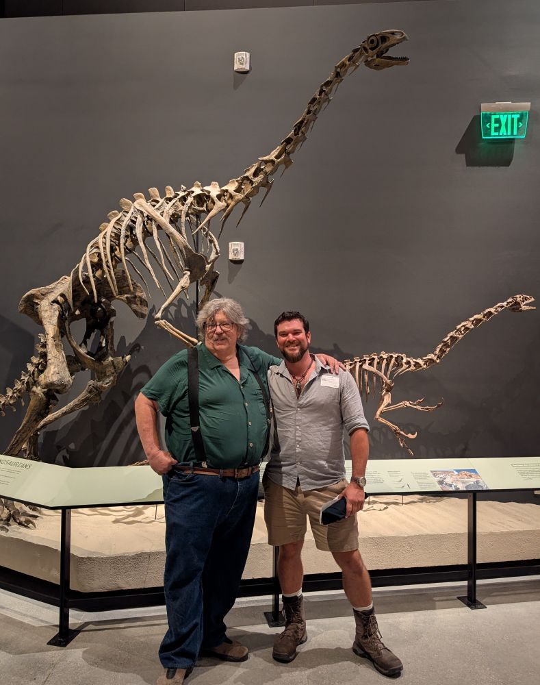 Photo of me (Danny Anduza) and Utah's state paleontologist Jim Kirkland.  We're standing in front of mounted cast skeletons of Nothronychus and Falcarius -- two North American therizinosaurs, both of which were published by Jim