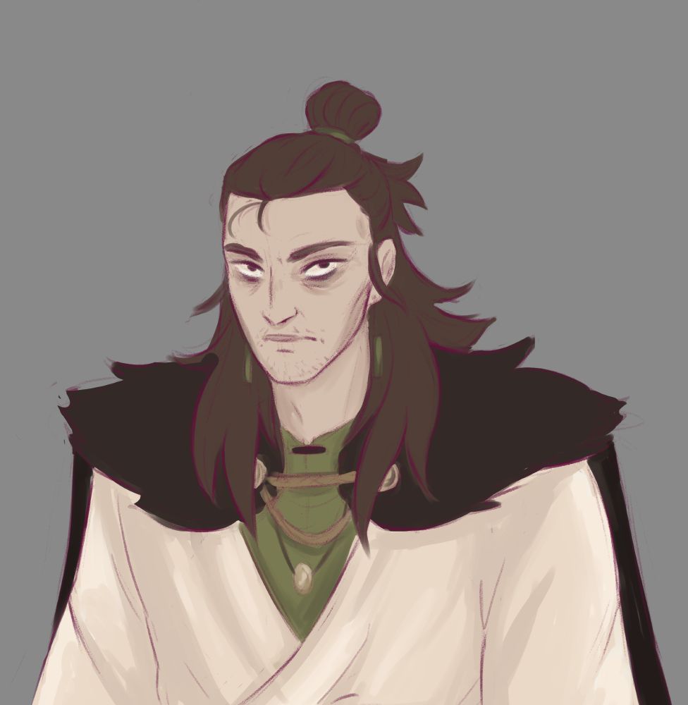 A digital half-body illustration of Noor on a grey background. Noor has light skin, dark eyes with eyebags, high cheekbones and stubble on his chin. He has dark brown hair which messily falls down his back and past his shoulder sin several thick strands. The top is pulled back into a loose bun held by a green band. He has dangling green earrings. He is wearing a green undershirt with a white wrapped top with loose sleeves above. He is wearing a gold necklace on a leather band. He is wearing a dark cape with fur around his shoulders, held together by gold clasps and brown cord at the front.