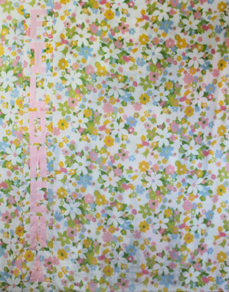 Back of baby quilt using an old sheet and spells out Filomena