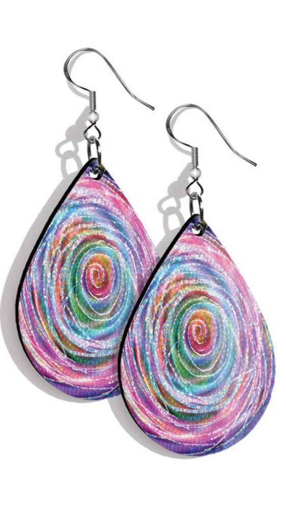 A pair of wooden teardrop earrings printed with my artwork, rainbow rose, showing the inside of a large rainbow color rose.