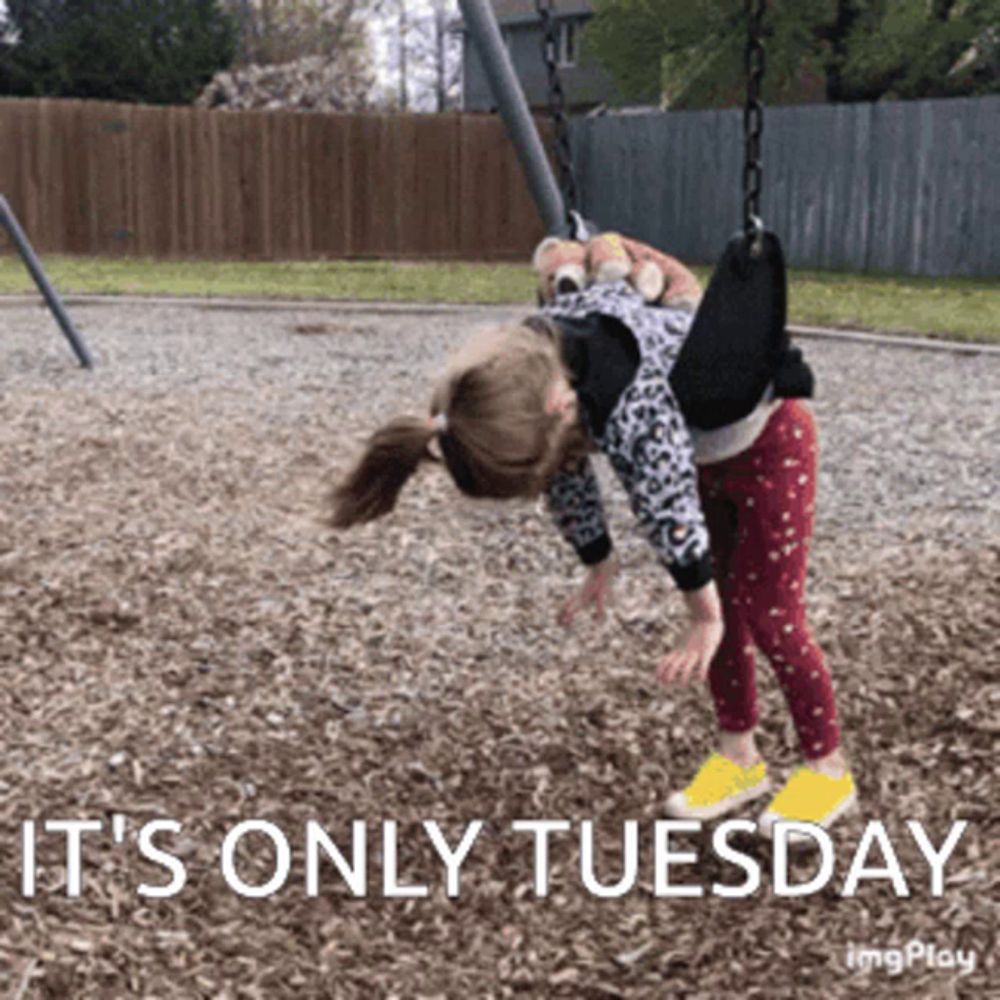 a little girl is upside down on a swing with the words it 's only tuesday below her