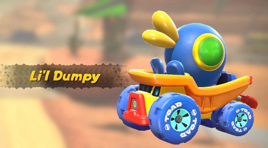 Cataquack from Mario sunshine in a little toy truck in orange, yellow, and red.  The text LITTLE DUMPY is on the left of it