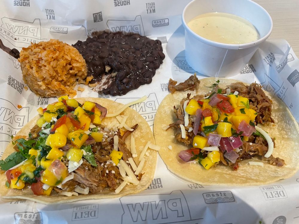 Two carnitas tacos, rice, beans, and queso from Bullseye Taco in Unthank Hall at the University of Oregon, Eugene