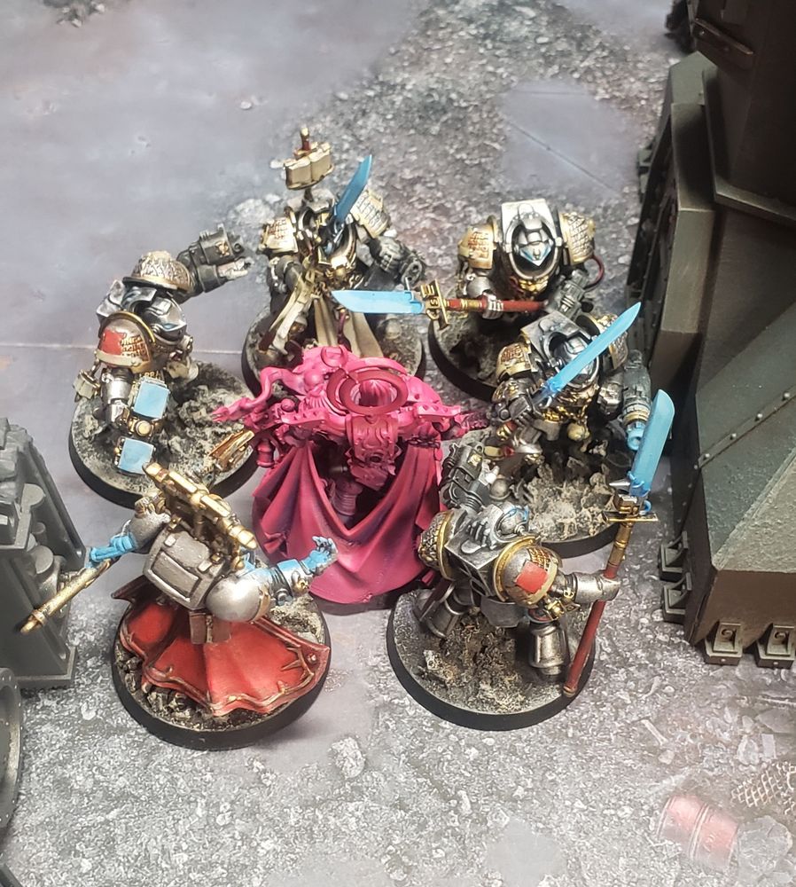 Lord Exultant is surrounded by 5 grey knight terminators and a terminator librarian