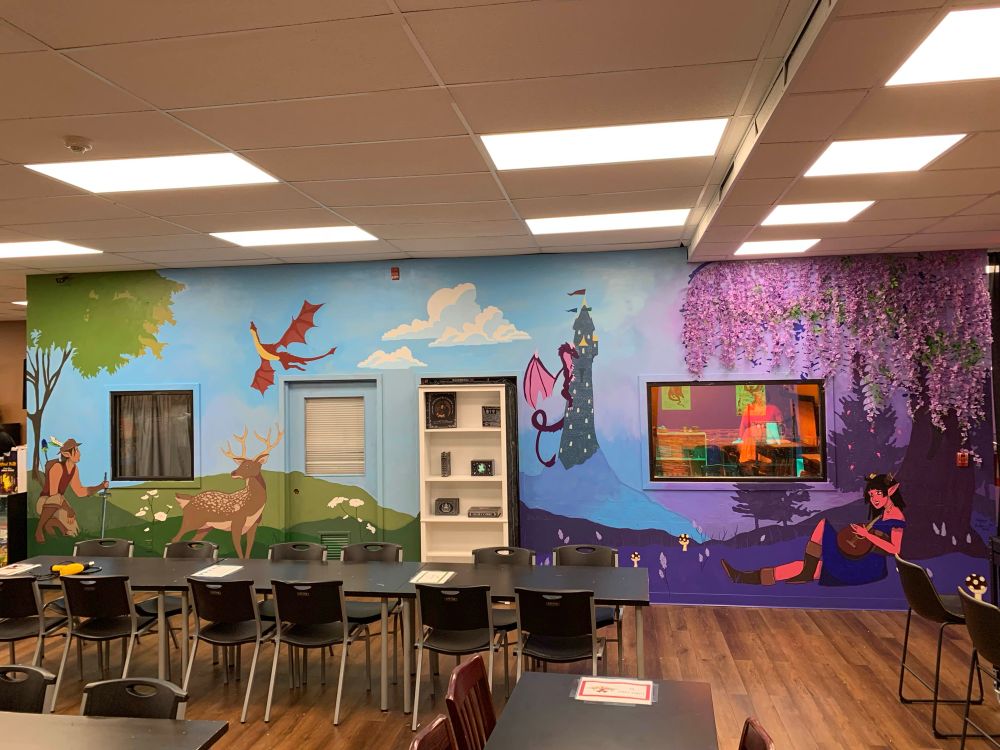Mural at a local TCG store. The leftside of the mural is green with a ranger, deer, and wyvern and the right side is purple, with a wizard's tower, wisteria tree, bard, and dragon