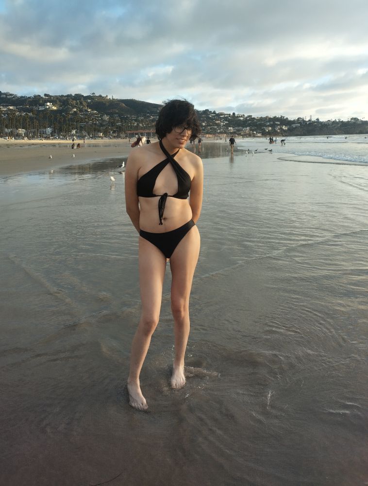 Woman at the beach in a halter top bikini