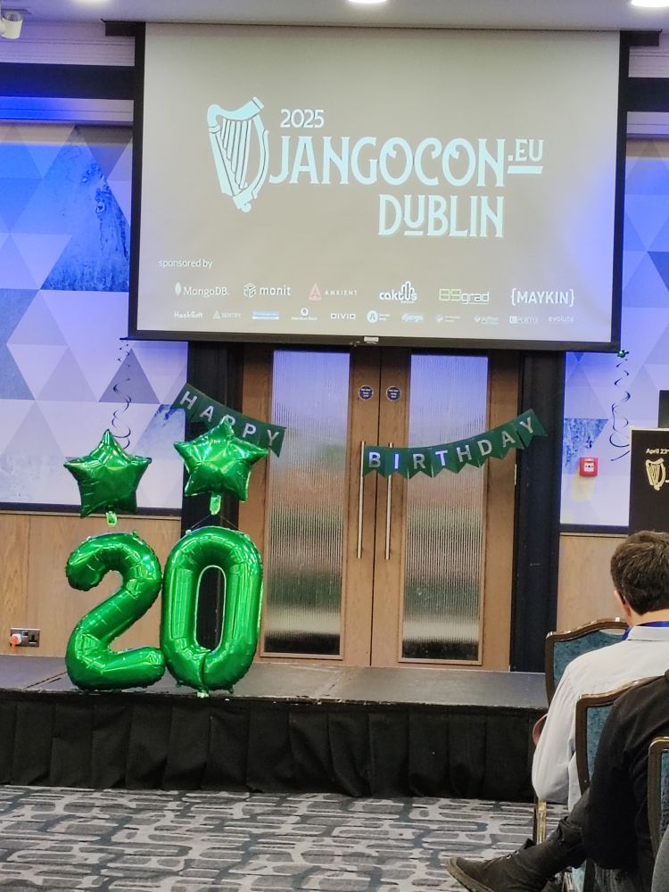 DjangoCon Europe screen with the sponsors in it. There is a green banner "happy birthday" and green balloons 20 with green stars on the top of the numbers