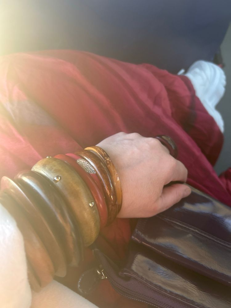 Red and purple maxi dress, chunky trainer, purple patent bag and wooden bangles all thrifted. Purple palm wood ring gifted by an ex husband.