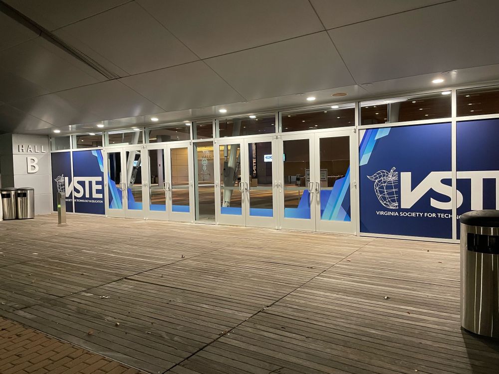 Entrance to the VA beach convention center - glass doors with vinyl decals with the VSTE logo on the doors on both ends