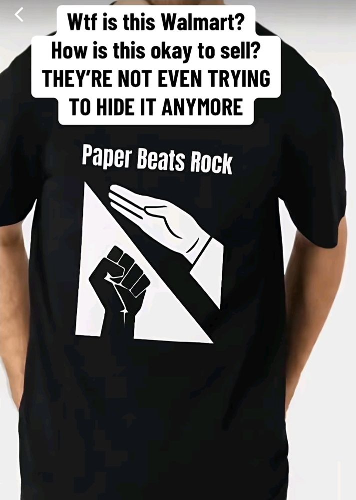 Black t-shirt with white hand making upward-angled paper shape (Nazi salute) over black hand making rock shape (power to the people fist). Captions read, "WTF Is this Walmart? How is this OK to sell? THEY'RE NOT EVEN TRYING TO HIDE IT ANYMORE."