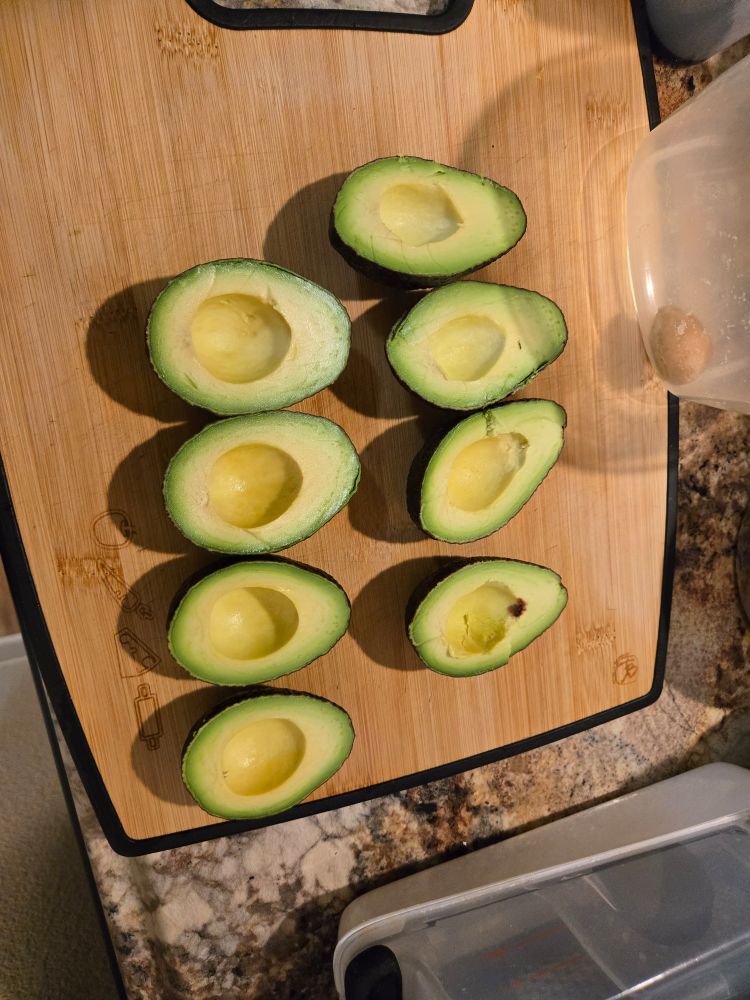 Eight perfectly ripe avocado halves.