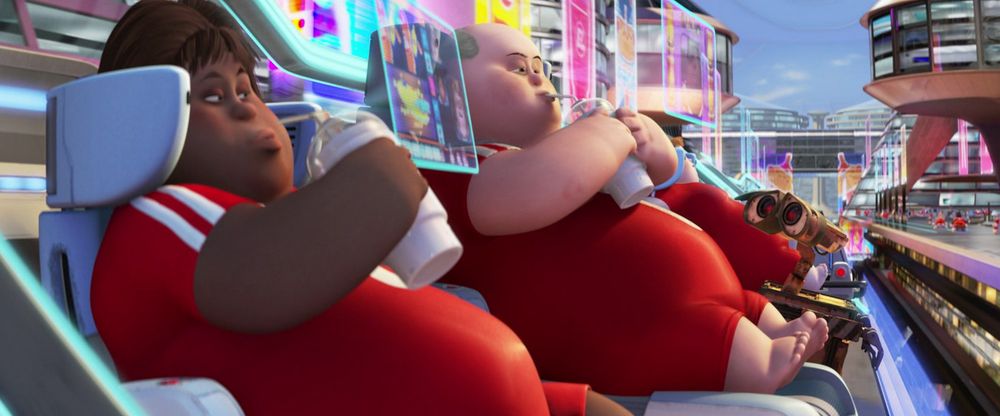 A screenshot from the movie Wall-E showing a row of obese people in floating mobile chairs drinking through straws and staring at screens projected in front of their faces.
