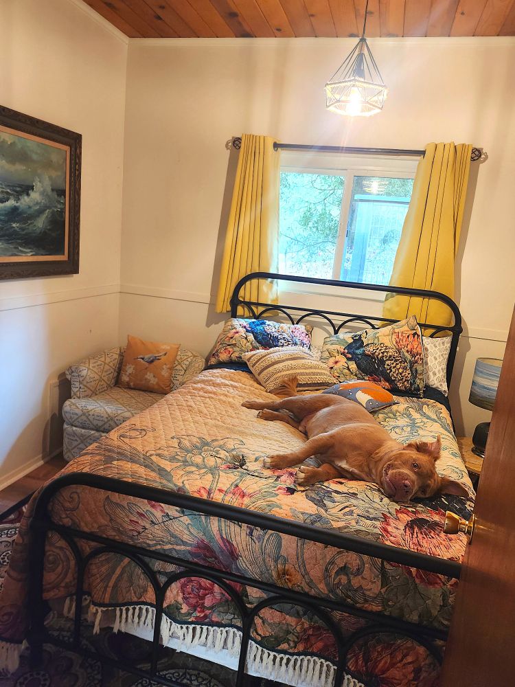 Cowboy on the guest bed through an open door