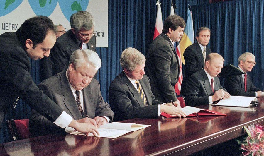 yeltsin, clinton and john major signing an agreement to protect Ukraine from attack back in the 1990s. 