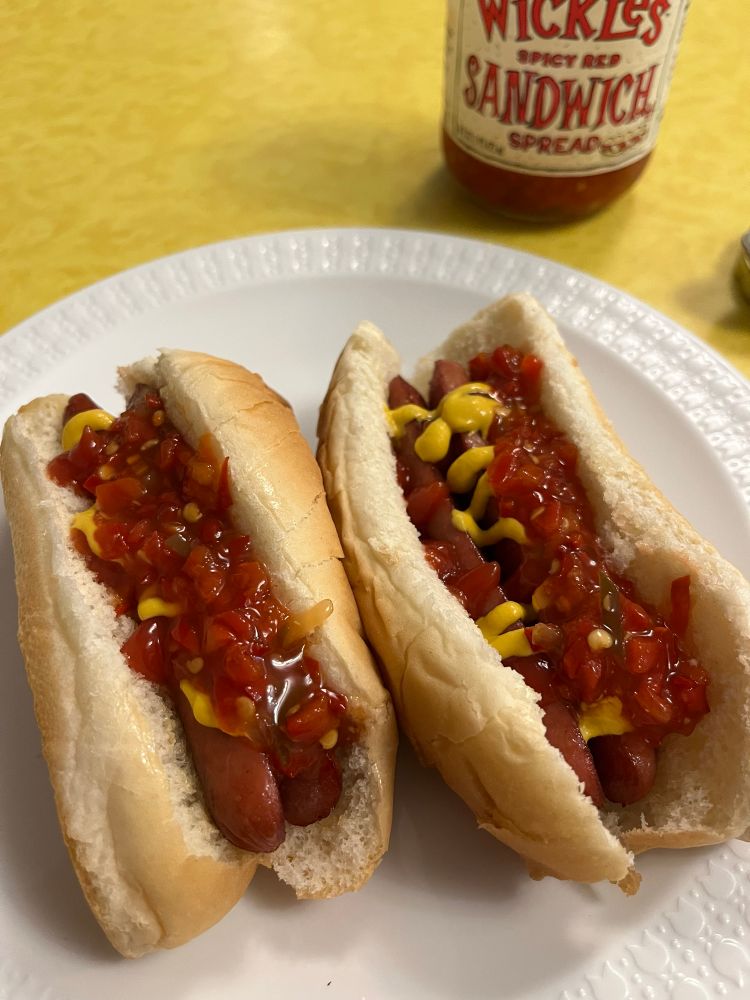 Hot dogs with mustard, ketchup, and wickles 