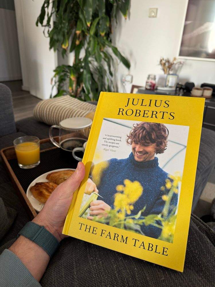 Me holding a copy of Julius Roberts’ book 