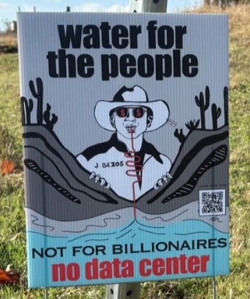 A sign protesting the Project Clydesdale data center development sits at the construction site on Nov. 25, 2025. Credit: Phillip Jackson / Tulsa Flyer

It depict an evil Jeff Bezos sucking water from a straw that reaches into the earth.